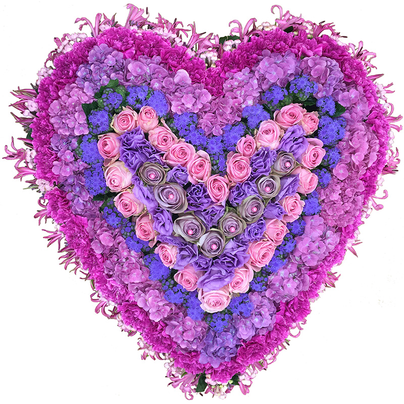 Rouwarrangement hart van roze en paarse bloemen