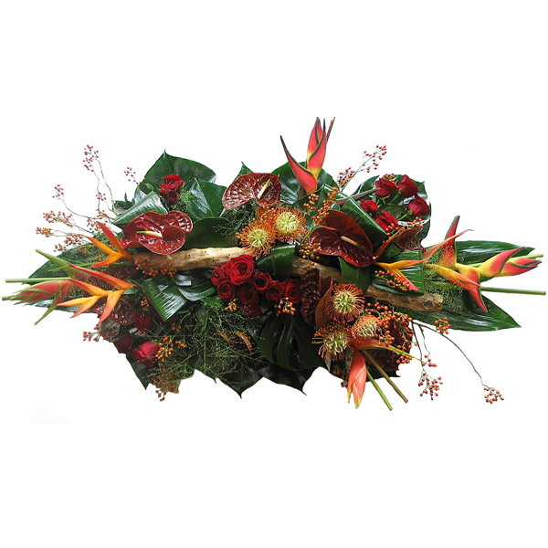 Rouwarrangement langwerpig rode tinten en luxe bloemen